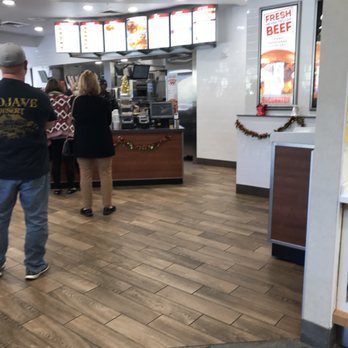 Wendy's - a man and a woman standing in a fast food restaurant - Burgers Near Me - Tehachapi, California