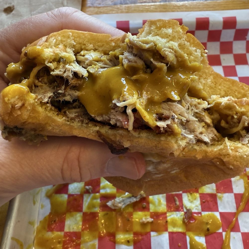 Pulled pork sandwich with mustard bbq sauce Pulled pork sandwich with mustard bbq sauce