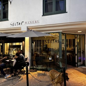 Sevtap Winery - a group of people sitting outside a restaurant - Wine Tasting Room Near Me - Solvang, California
