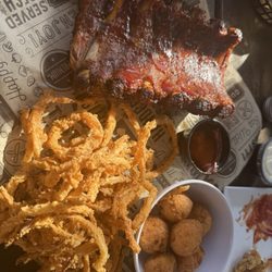 The Crawfish Hole - Ribs with a side of hush puppies and onion rings
