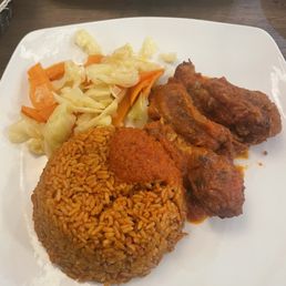 Jollof Rice w/stew chicken Jollof Rice w/stew chicken
