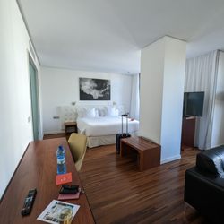 Iberostar Heritage Grand Mencey - Desk, welcome macaroons and view of the bed and one of the TVs