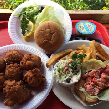 Flo's Clam Shack - (From left to right) Clam cakes, "crabby" cake sandwich and a lobster platter. Flo's Clam Shack in Middletown. Aug 18. - Seafood Near Me - Middletown, Rhode Island Flo's Clam Shack - (From left to right) Clam cakes, "crabby" cake sandwich and a lobster platter. Flo's Clam Shack in Middletown. Aug 18. - Seafood Near Me - Middletown, Rhode Island