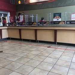Counter with employees behind counter hard at work