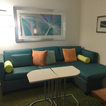 SpringHill Suites by Marriott Wisconsin Dells - Seating area with a nearby TV away from sleeping area. - Hotels Near Me - Wisconsin Dells, Wisconsin