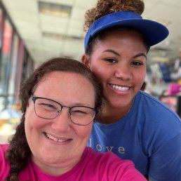 a woman and a woman in a pink shirt a woman and a woman in a pink shirt