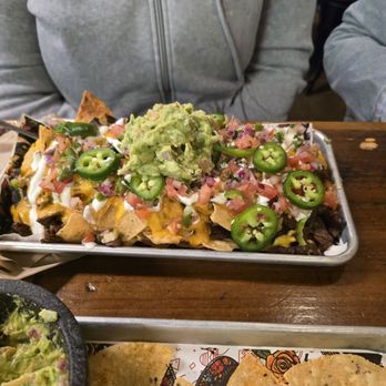 El Taco H - Half Nacho with carne asada - Tacos Near Me - Denton, Texas El Taco H - Half Nacho with carne asada - Tacos Near Me - Denton, Texas