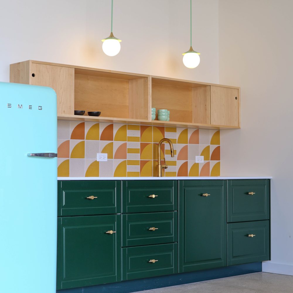 Daniel Tiles Design - a kitchen with green cabinets and a blue refrigerator - Tiling Near Me - Chicago, Illinois Daniel Tiles Design - a kitchen with green cabinets and a blue refrigerator - Tiling Near Me - Chicago, Illinois