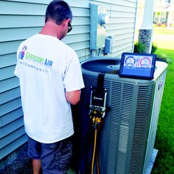 Efficient Air Heating & Cooling - JJ repairing a unit