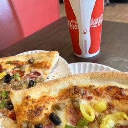 The New York Pizza Company - Specialty Pizza slices 2 slices and one drink 10.00  but they are huge slices.... good deal..... 4 thumbs up....
