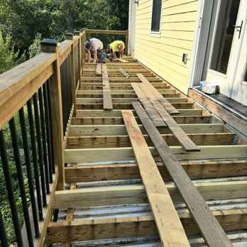 Fugon Contracting - Before: Old framing and unfinished patio deck. - Painters Near Me