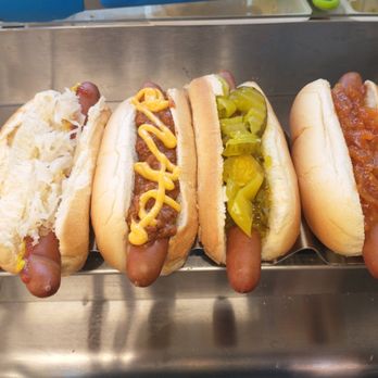 What Up Dogs - three hotdogs with mustard and relish - Hot Dogs Near Me What Up Dogs - three hotdogs with mustard and relish - Hot Dogs Near Me