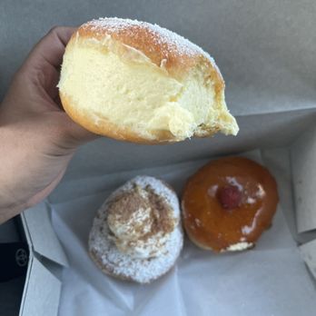 Friendly Donuts - I'm holding the french cream and the one next to the creme brûlée is the banana pudding donut! - Donuts Near Me - Orange, California Friendly Donuts - I'm holding the french cream and the one next to the creme brûlée is the banana pudding donut! - Donuts Near Me - Orange, California