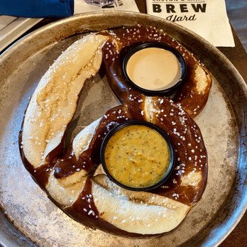 Caston & Main Brew Yard - Giant soft pretzel with brew cheese and whole grain mustard - New American Near Me - Akron, Ohio