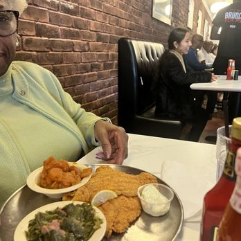 T's Brunch Bar - Fried Catfish served with mac-n-cheese and collards - Breakfast & Brunch Near Me - Atlanta, Georgia