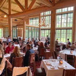 a large dining room full of people a large dining room full of people