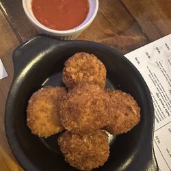 Hooker Grocer & Eatery - Appetizer polenta puppies. Very crispy. Outside lacked seasoning and the inside was bland. The crunch was great but no flavor inside.