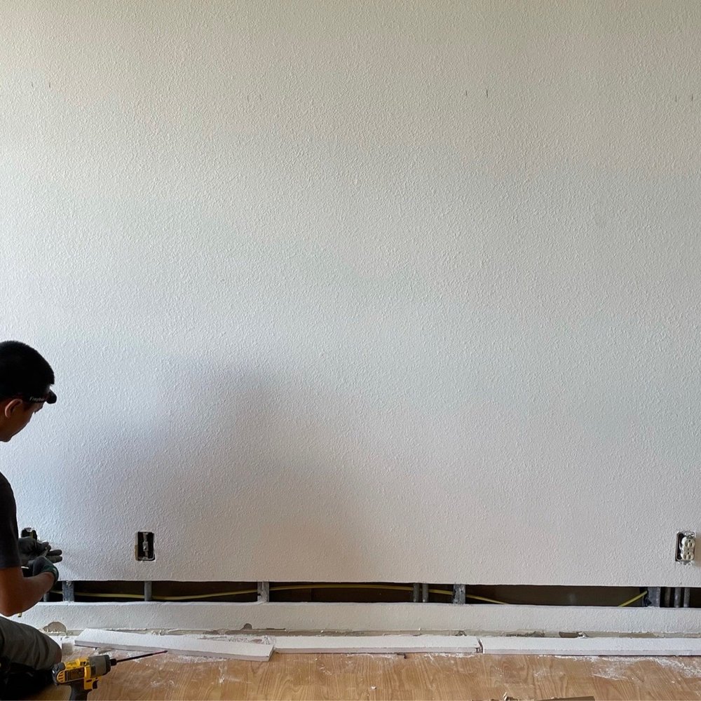 Jet’s Electrical - The process of installing electrical in the entertainment wall. Sconces, outlets, and TV with wires through wall. - Electricians Near Me Jet’s Electrical - The process of installing electrical in the entertainment wall. Sconces, outlets, and TV with wires through wall. - Electricians Near Me