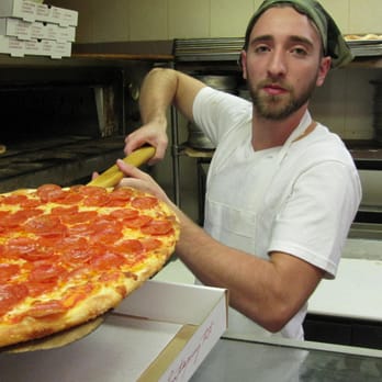 Luigi's Pizzeria - Artist at work - Pizza Near Me - Brooklyn, New York Luigi's Pizzeria - Artist at work - Pizza Near Me - Brooklyn, New York