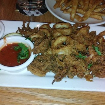 BJ's Restaurant & Brewhouse - Fried calamari and french fries. - New American Near Me - Hurst, Texas BJ's Restaurant & Brewhouse - Fried calamari and french fries. - New American Near Me - Hurst, Texas