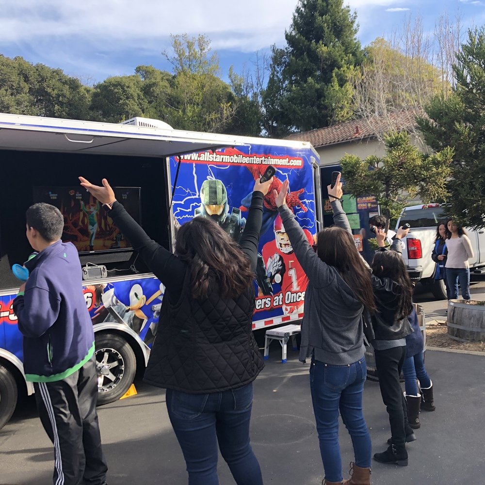 All Star Mobile Entertainment - Exterior of the truck also has gaming consoles. - Game Truck Rental Near Me