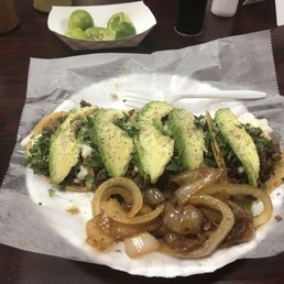 Bisteck Tacos w/grilled onions,cheese and avocado Bisteck Tacos w/grilled onions,cheese and avocado