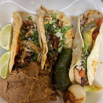 El Muchacho Alegre - Two la taquiza tacos on the left and one carnitas taco on the right. Jalapeno and onion came with my entree - Mexican Near Me - Papillion, Nebraska El Muchacho Alegre - Two la taquiza tacos on the left and one carnitas taco on the right. Jalapeno and onion came with my entree - Mexican Near Me - Papillion, Nebraska