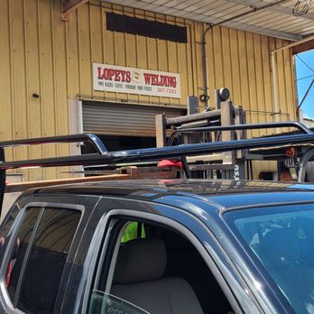 Lopey's Mini Crane Service - Securing the new racks to the bed of the truck. - Crane Services Near Me - Kaneohe, Hawaii Lopey's Mini Crane Service - Securing the new racks to the bed of the truck. - Crane Services Near Me - Kaneohe, Hawaii