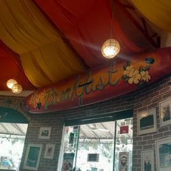 Gabby’s Bed & Breakfast - The restaurant is very colorful given including the ceiling .