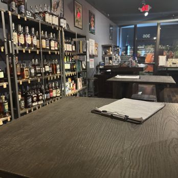 Mitch e Amaro - Small tables, store area - Cocktail Bars Near Me - North Kansas City, Missouri