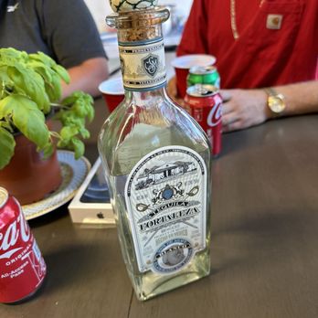 Bros Liquor - two people sitting at a table - Beer, Wine & Spirits Near Me - West Sacramento, California
