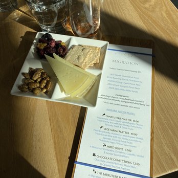 Migration Winery - The menu and the day's featured wine tasting. - Wine Tasting Room Near Me - Napa, California Migration Winery - The menu and the day's featured wine tasting. - Wine Tasting Room Near Me - Napa, California