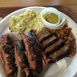 a plate of meat and beans