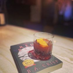 Fuse Global Cuisine - A bourbon-based drink known as, "Writer's Block" with a Red Bird garnish.