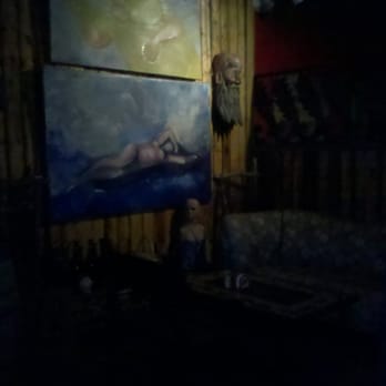 Cafe Kino - a painting of a woman on a couch - Pizza Near Me - Nogales, Arizona