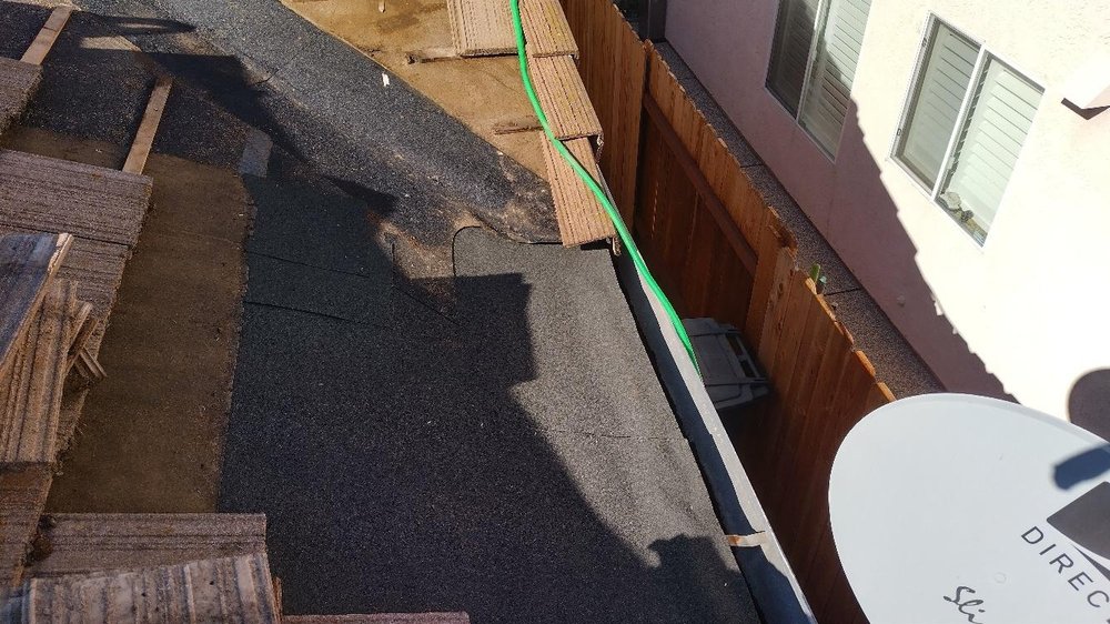 Slide of Quinn Bro's Roofing