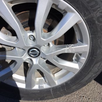 Skyview Parking - Both rear rims, used grappling hooks to try to pull car out of ice - Parking Near Me - Calgary, Alberta