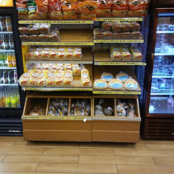 Golden Krust - a display of food in a grocery store - Bakeries Near Me - Conyers, Georgia Golden Krust - a display of food in a grocery store - Bakeries Near Me - Conyers, Georgia