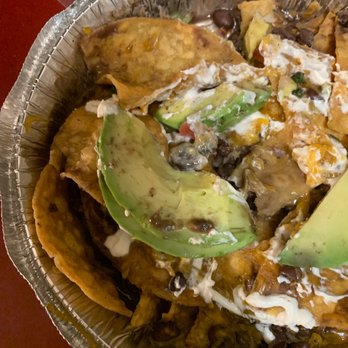 Ricky's Cafe - SOGGY NACHOS.  WITH NO CHEDDAR CHEESE   NO JALAPEÑOS.     SHE GAVE ME CILANTRO          TERRIBLE - Breakfast & Brunch Near Me - Jackson Heights, New York