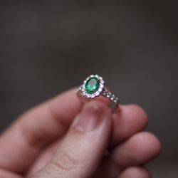Emerald Ring surrounded by a Halo of Diamonds.