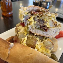 Bacon, eggs. Potato, and long hots on sarcone fresh baked Italian bread. Bacon, eggs. Potato, and long hots on sarcone fresh baked Italian bread.
