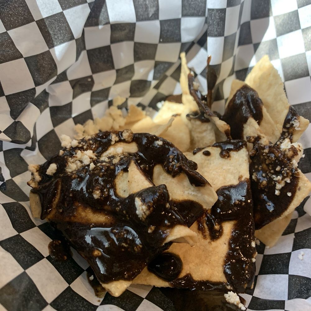 El Buen Pastor - Chips in Oaxacan mole and cheese - Mexican Near Me - Bakersfield, California El Buen Pastor - Chips in Oaxacan mole and cheese - Mexican Near Me - Bakersfield, California