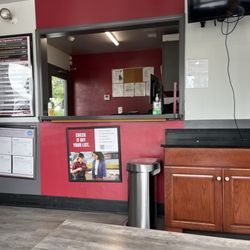 Jiffy Lube - Waiting room with unisex bathroom.