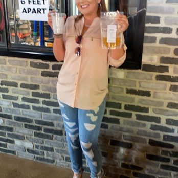 Five Wits Brewing Company - This is my friend Emma posing with her bag drink in front of the brewery windows - Breweries Near Me - Chattanooga, Tennessee Five Wits Brewing Company - This is my friend Emma posing with her bag drink in front of the brewery windows - Breweries Near Me - Chattanooga, Tennessee