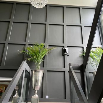 IVY BUILD - a plant in a vase on the stairs - Structural Engineers Near Me IVY BUILD - a plant in a vase on the stairs - Structural Engineers Near Me