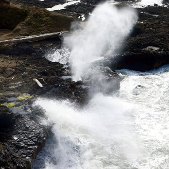 Spouting Horn - Spouting Horn at various levels of high tide waves coming in from the other viewpoint with a more birds-eye view - Beaches Near Me - Florence, Oregon