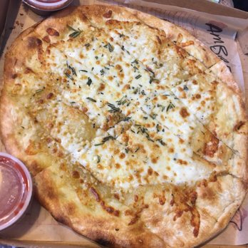 MOD Pizza - cheesy garlic bread side with marinara dip on the side - Fast Food Near Me - Houston, Texas