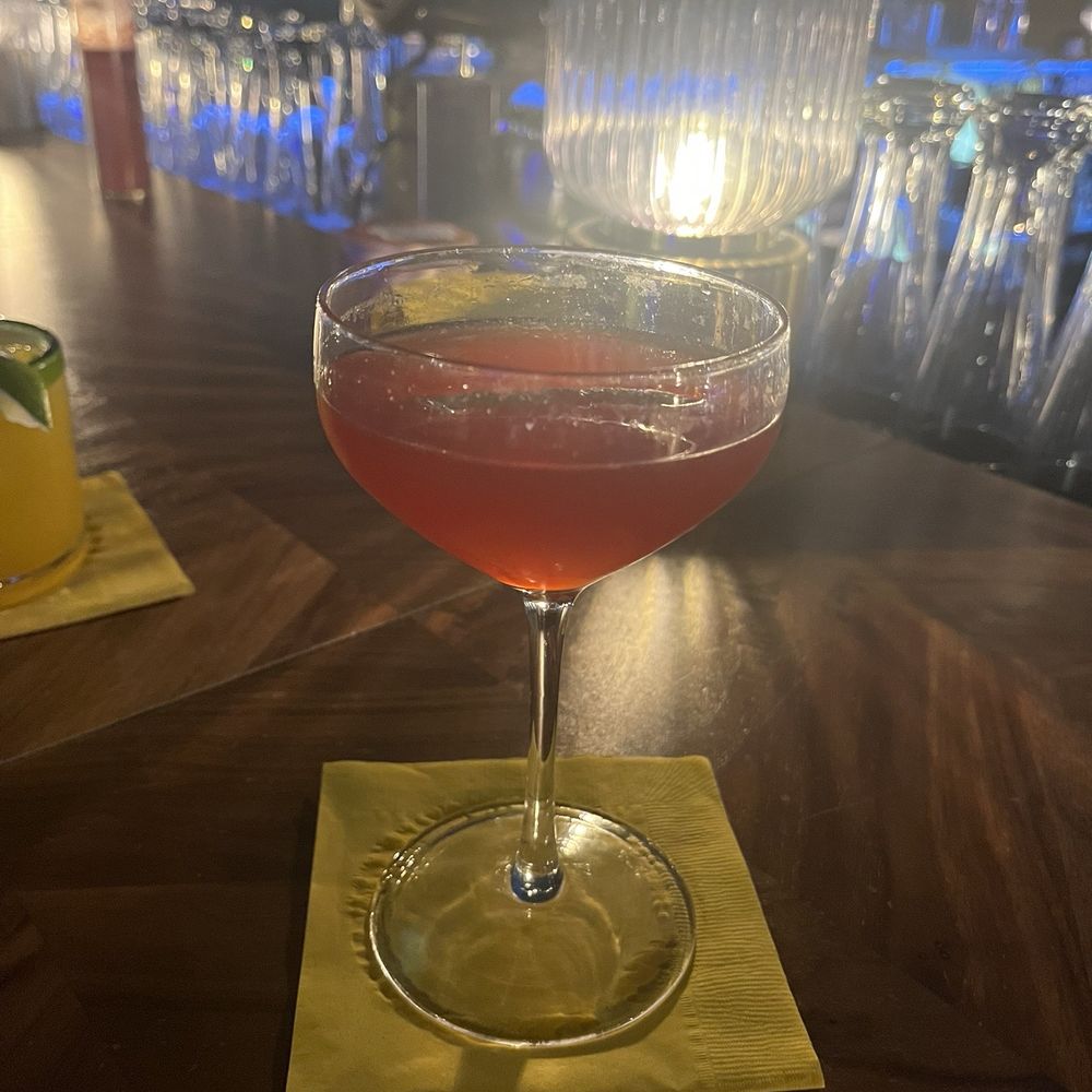 Cranberry, lime, and soda water mocktail.
