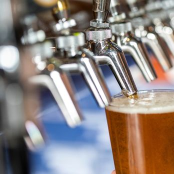 Overflow - a pint of beer being poured - Wine Bars Near Me - Mooresville, North Carolina Overflow - a pint of beer being poured - Wine Bars Near Me - Mooresville, North Carolina