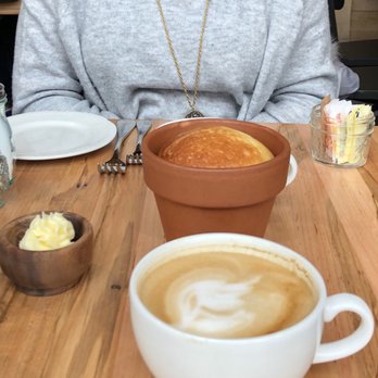 Terrain Cafe - A delicious bread made in a flower pot, complemented with a delicious honey butter. Maple latte was pretty good too! - Breakfast & Brunch Near Me - Bethesda, Maryland